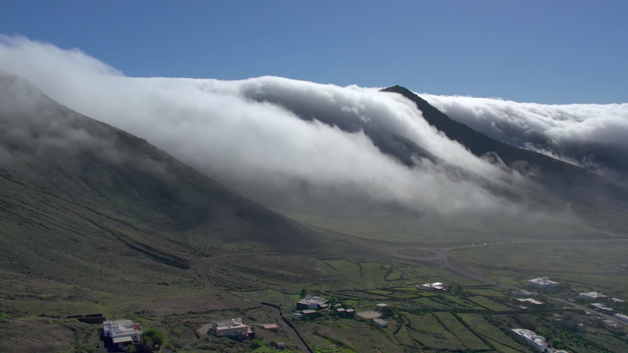 Aerial drone view of mountain sea and volcanoes in Lanzarote, Canary Islands, Spain
