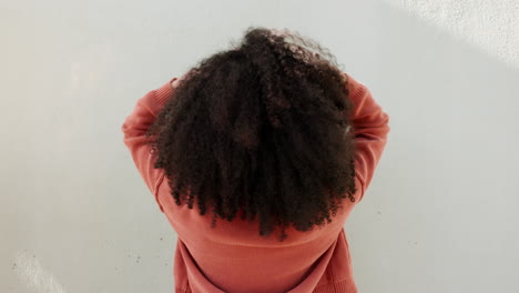 woman with natural hair and afro curls on white