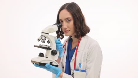 female scientist or doctor using a microscope
