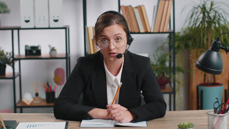 Businesswoman-working-on-laptop-wearing-headset-call-center-support-service-operator-office-helpline