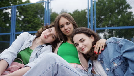 teenagers posing outdoors