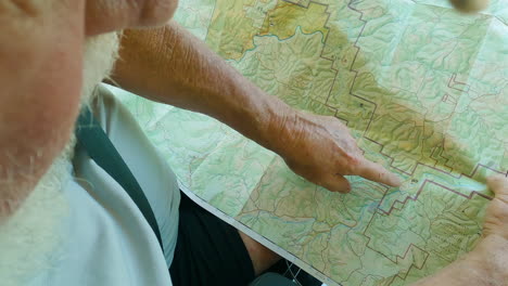 Close-up-of-an-old-person-tracking-a-trekking-trail-near-Buffalo-River-