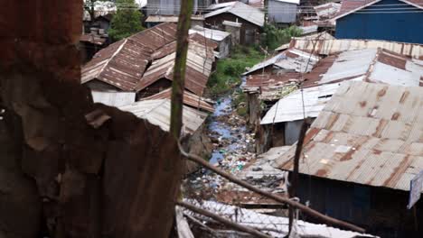 open air sewage running through a slum in nairobi