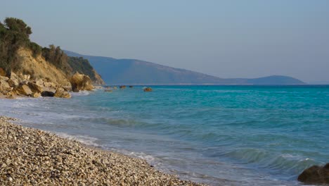 paradise rocky beach with no people on rocky coastline of ionian sea with blue turquoise water