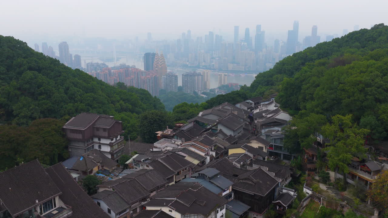 Huangjueya Old Street Overlooking The Modern City Of Yuzhong District In Chongqing, China. Aerial Shot