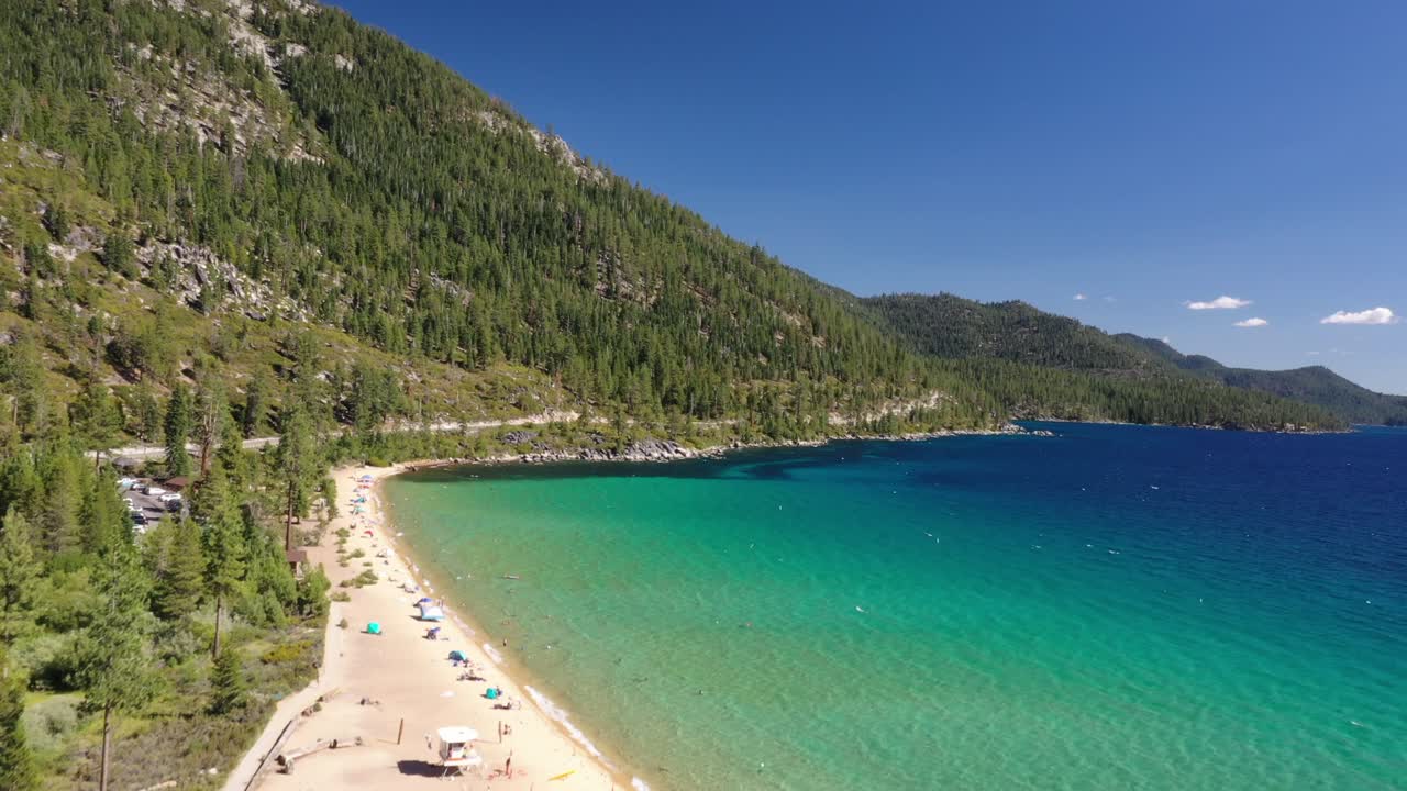 Turquoise Seascape With Lush Mountains At Daytime in lake tahoe- aerial drone shot