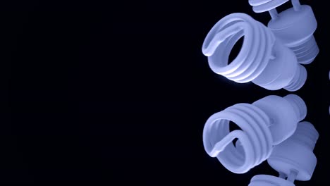 spiral fluorescent light bulbs on black background