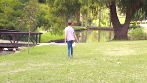 Happy-little-girl-walking-on-grass