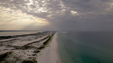 sunrise with a spotlight on clear waters in the gulf of mexico on florida island