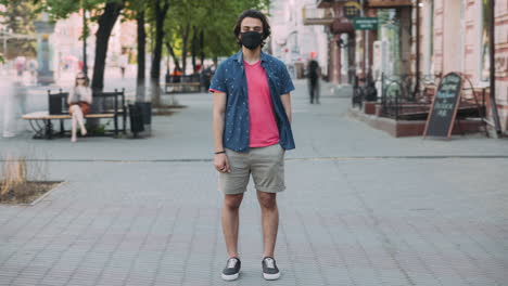 Man Wearing Mask on City Street