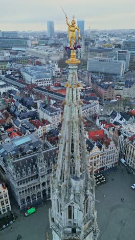 aerial view of brussels town hall spire with saint michael statue