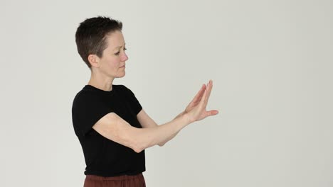 woman with short hair gesturing with hands