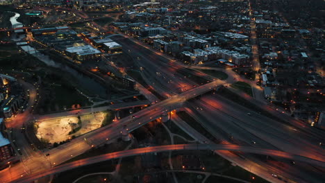 night traffic in denver, colorado usa, freeway overpass, street lights and cars, drone aerial view