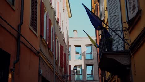 charming italian alleyway with red shutters