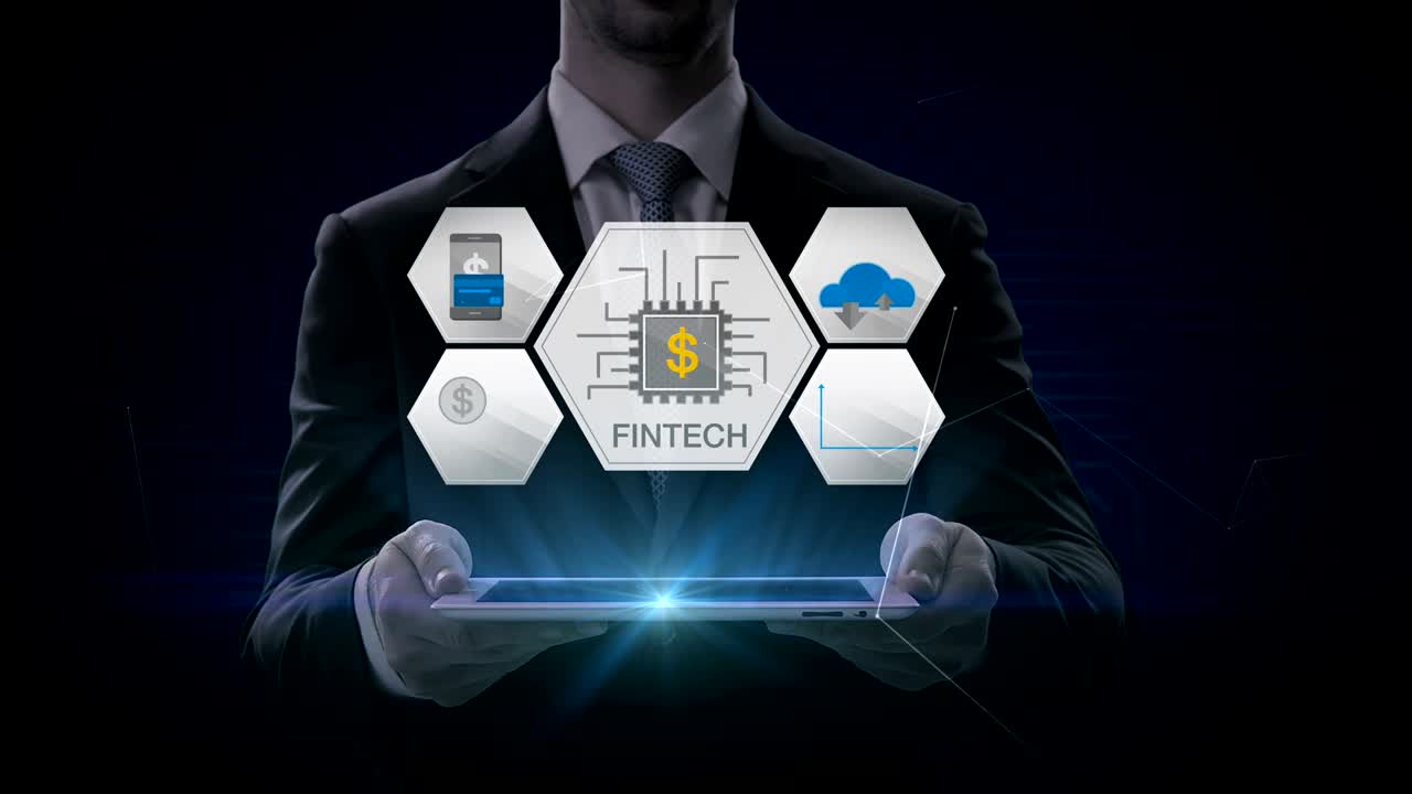 Businessman lifting a smart pad, tablet, Fin-tech icon and various graph. Futuristic financial technology. 4k movie. version 2.