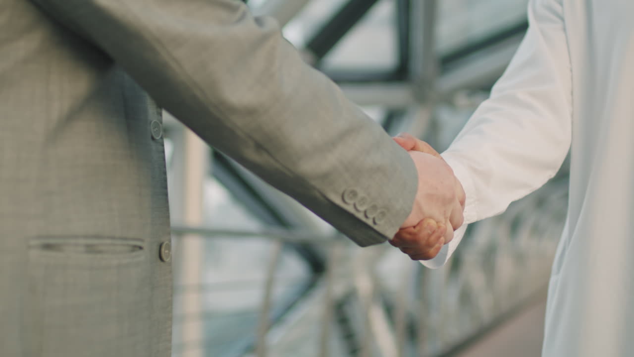 Diverse Business Partners Shaking Hands