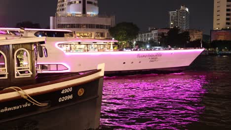 nighttime river cruise with vibrant city backdrop