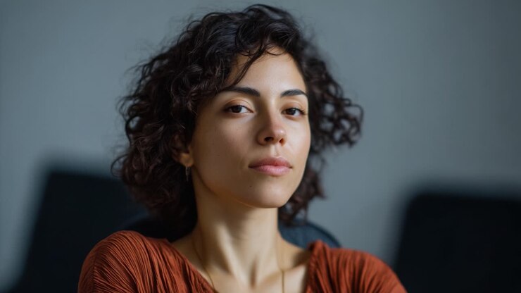 A woman transitions from a serene, reflective moment to a more confident and assertive expression, capturing a dynamic shift in emotions and presence