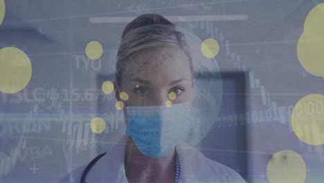 Animation-of-data-processing-over-caucasian-female-doctor-with-face-mask