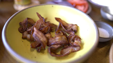 crispy bacon on hand-crafted bowl