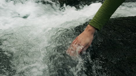 hand in a mountain stream