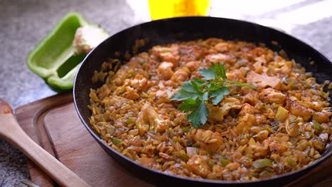 hot cooked vegetarian rice with cauliflower in a pan topped with fresh parsley