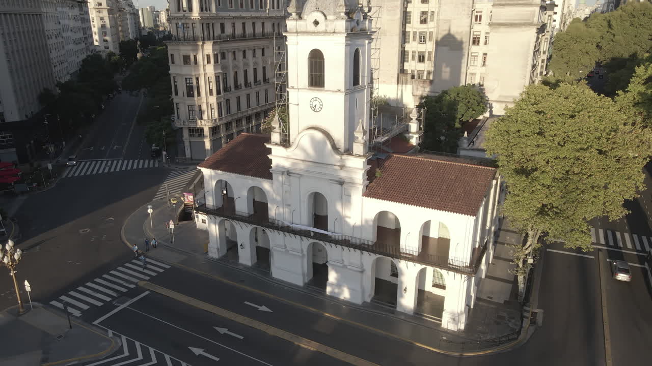 Aerial Drone flying around the Cabildo building of Buenos Aires, Argentina. May Square, Famous Revolution's landmark, morning sun.