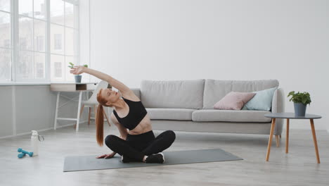 woman doing a stretching exercise at home