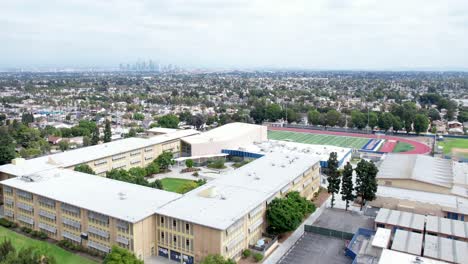 crenshaw high school, bad area of los angeles, south central community, overlooking city, rising aerial