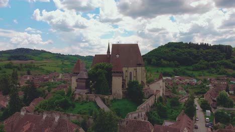 moving backwards drone shot reveals biertan's fortified church