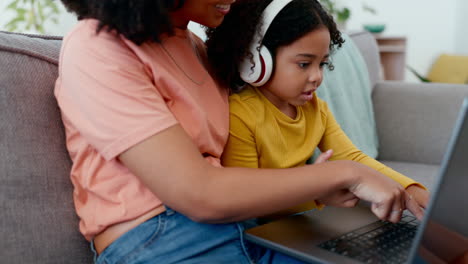 Child,-mother-and-headphones-with-laptop