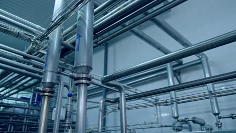 modern metal equipment. dairy factory industrial equipment with metal tubes