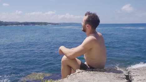 unhappy young man on the beach.