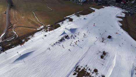 aerial descend over dolni morava snowy skiing track, extreme winter sport event