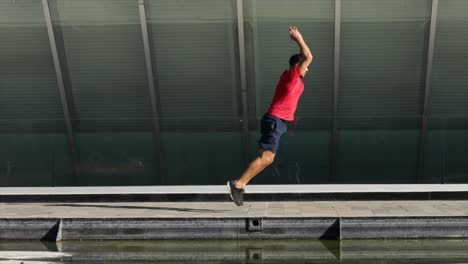 man training jumping outdoors urban landscape
