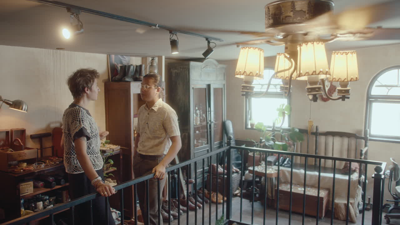 Collector Discussing Antiques with Woman in Vintage Shop