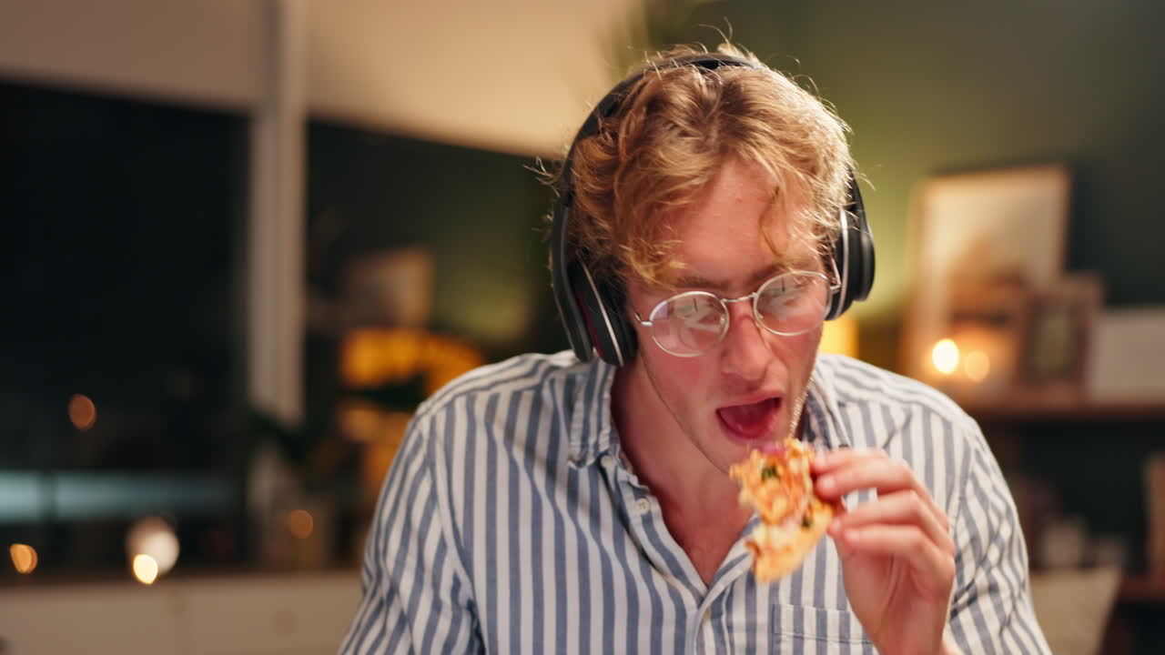 Man wearing headphones and glasses