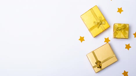 animation of christmas presents and stars on white background