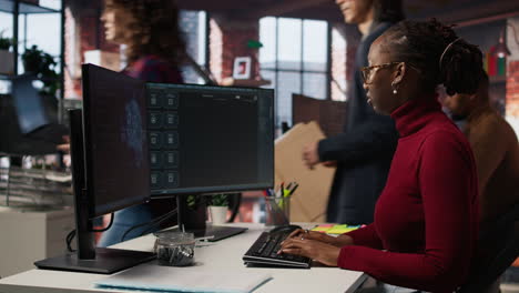 IT engineer interacts with AI LLM chatbot on PC in software development startup