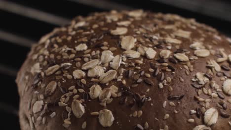 close-up of a toasted, seed-topped burger bun