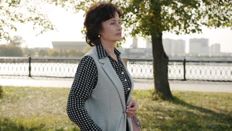 mature woman walking in a park