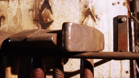 Close-up-of-various-hammers-at-workshop