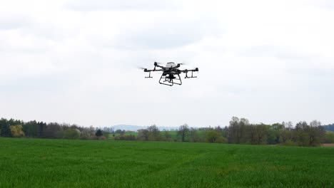 modern farming tech, agriculture drone flying above green crops 50fps