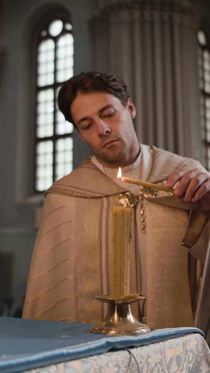 Priest Lighting Candle in Church