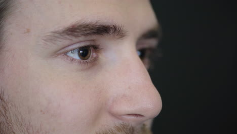 close up of young man eyes puts on glasses cute caucasian geek eyesight vision