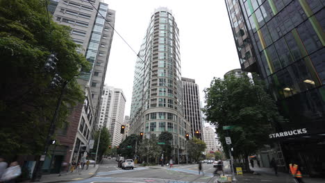 city street view with modern skyscrapers and starbucks