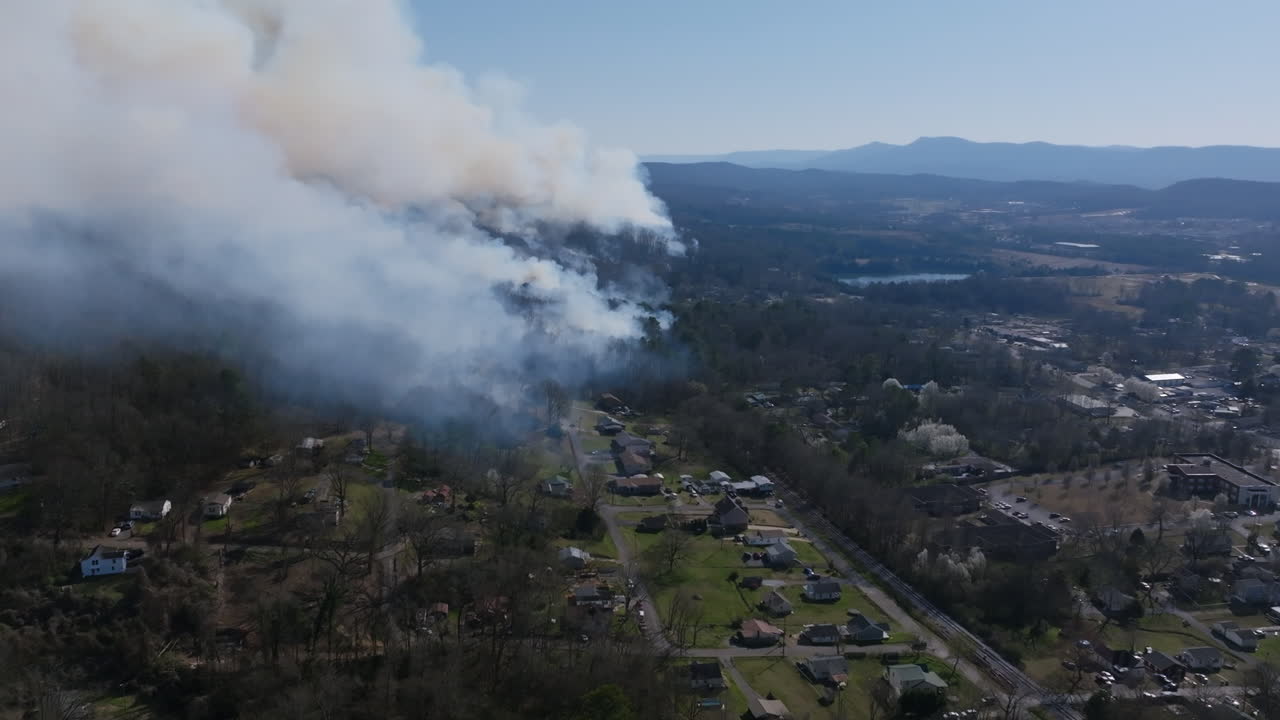 Aerial drone footage of a large forest fire in Rossville, Georgia.