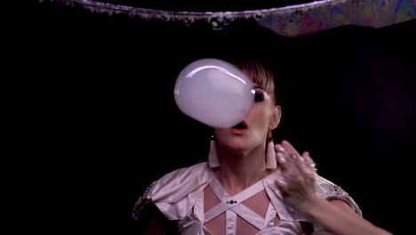 CU-Slow-motion-Tricks-with-soap-bubbles-girl-blowing-on-a-bubble-with-smoke-through-a-soap-screen