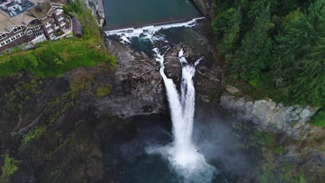 aerial that transitions from looking at snoqualmie falls to looking down at the waterfall