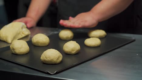 chef baker burger buns preparation before taking inside oven hamburger bun